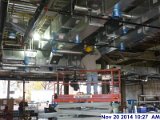 Installing ductwork fittings at the 1st floor Facing North.jpg